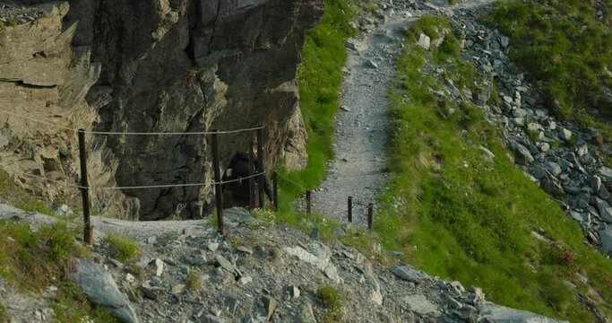 A Man Is Walking On Ghiacciaio Fellaria Hike Trails In Valmalenco, Italy. Aerial Drone Shot
