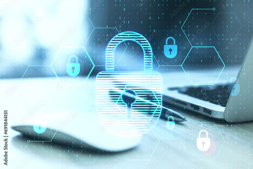 Leinwandbilder Close up of laptop, computer mouse and pen at desk with glowing hexagonal padlock hologram and binary coding on blurry background. Safety and internet concept. Double exposure.