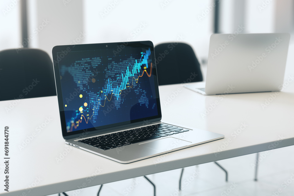 Poster close up of laptop on desk with glowing candlestick forex chart on blurry background. trade, finance