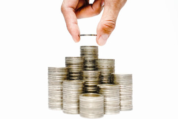 Business growth concept, Financial growth ,Man's hand put money coins on coins stack,Increasing piles of coins