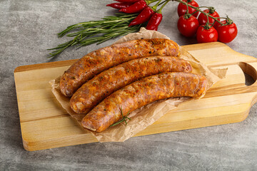 Raw sausages with spices and herbs