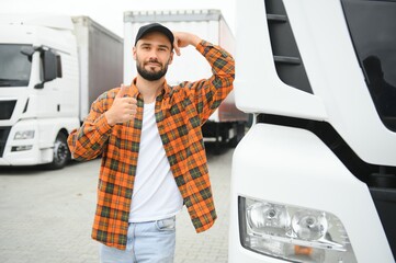 Portrait of confident truck driver on parking lot. Copy space