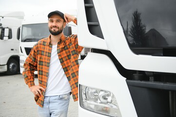 Portrait of confident truck driver on parking lot. Copy space