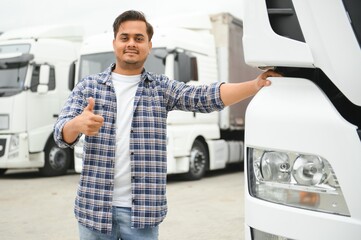 Portrait of confident indian truck driver on parking. Copy space