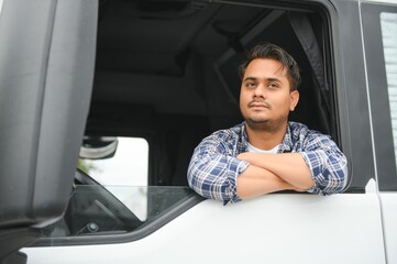 Young Indian truck driver. Concept of road freight transportation