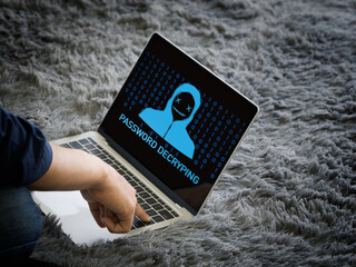 Young man use his finger press enter key on laptop computer keyboard, password decrypting displayed on the screen.