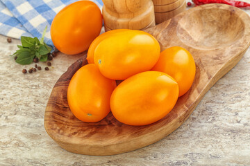 Sweet ripe yellow tomato in the bowl