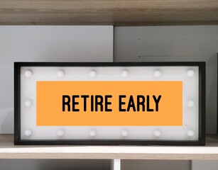 Fototapeta premium Photo frame with text written Retire Early - refers to practice of retiring before reaching usual employer's official retirement age - stop working before 60