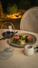 beef and glass of red wine on the table