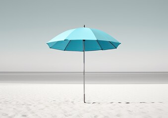 A minimalist photograph of a light blue umbrella against a white sandy beach. The camera angle is a