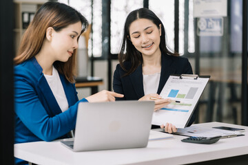 Fototapeta premium Business team meeting present.professional investor working with new startup project. Finance managers task.Digital tablet laptop computer design smart phone in morning light.