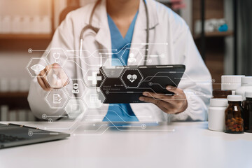 Medical technology concept. Doctor working with mobile phone and stethoscope and digital tablet laptop in modern office. - obrazy, fototapety, plakaty