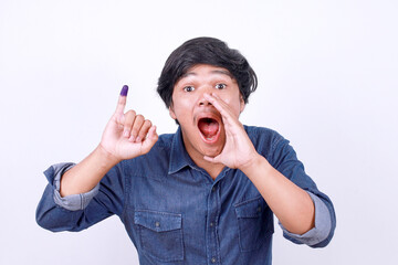 Excited young Asian man calling everyone after voting on Indonesia presidential election. Election...