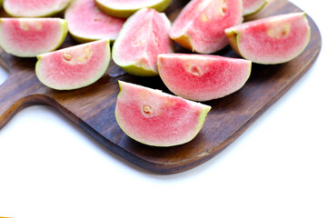 Fresh pink guava on white background.