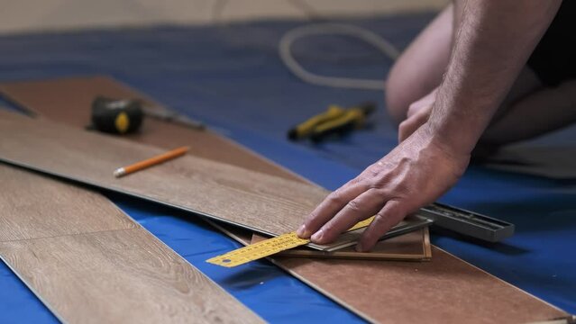 Precise measurement for a perfect fit, hands at work. A testament to the craftsmanship in home improvement.