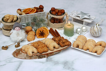 Christmas cookies and Christmas decorations on a festively decorated table.