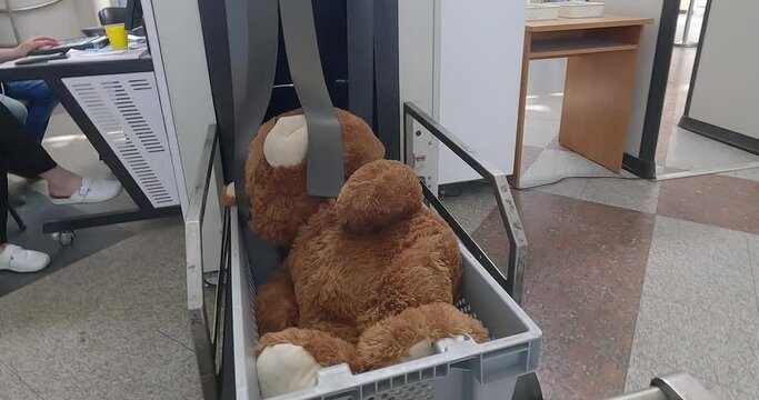 Airport Scan Checked Luggage. X-ray luggage screening machine. Teddy Bear Soft Toy