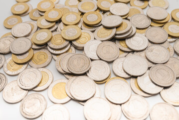 Polish Zloty coins. 1, 2 and 5 PLN coin background on the white table.
