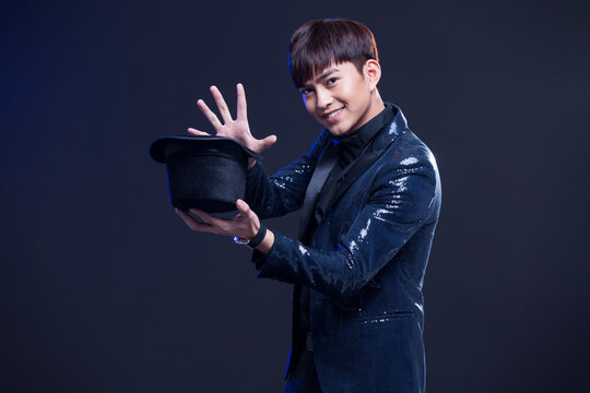Young magician performing magic trick
