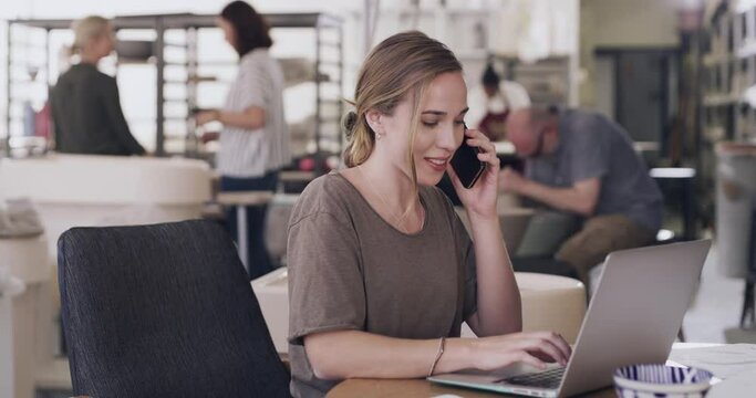 Woman, phone call and laptop in pottery office for networking, connection and b2b at small business project. Smartphone conversation, computer and girl at desk at creative startup with clay product.