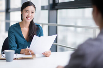 Young businesswoman conducting job interview