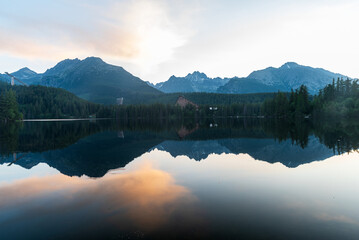 Strbske pleso lake with peaks above in High Tatras mountains in Slovakia during early morning...