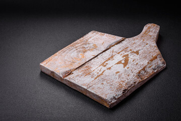 Empty wooden cutting board for preparing ingredients for preparing a delicious dish