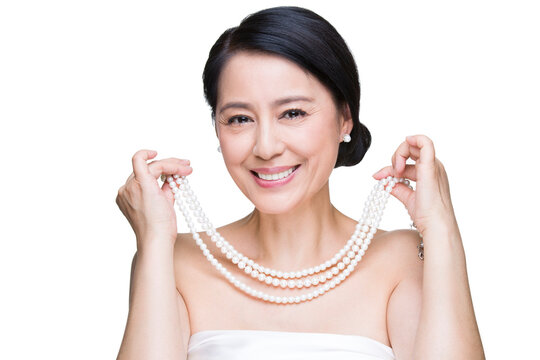 Beautiful mature woman with pearl jewelries