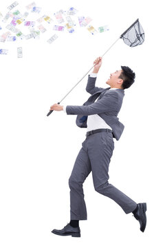 Businessman catching money with butterfly net