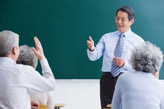 Senior adults having class at school