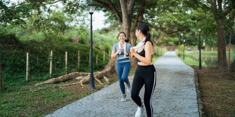 Healthy and active lifestyle, sport concept. Attractive ecstatic young sportswoman, smiling joyfully as jogging, sprinter run in park