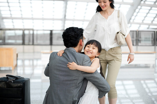 Excited family reuniting at the subway station