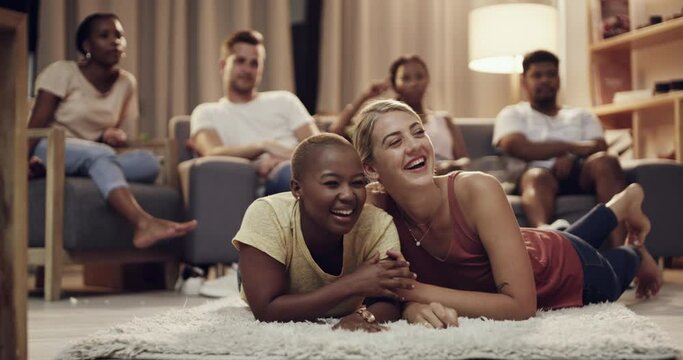 Friends, watching tv and living room with group with laughing, bonding and conversation at home. Couch, chat and diversity of people together with movie, film and relax in a lounge with discussion