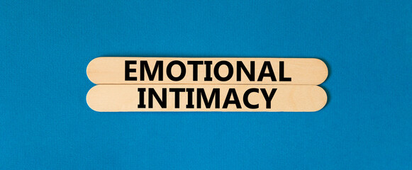 Emotional intimacy symbol. Concept words Emotional intimacy on beautiful wooden stick. Beautiful blue table blue background. Psychology emotional intimacy concept. Copy space. - obrazy, fototapety, plakaty