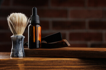 Cosmetics for man, Bottle essential oil for beard men on background dark brick.