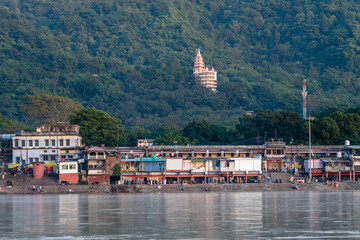 views of rishikesh city crossed by ganges river, india - obrazy, fototapety, plakaty