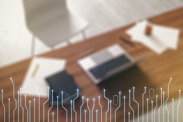 Double exposure of circuit hologram and modern desktop with laptop on background. Research and...