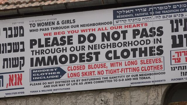 Sign asks visitors to dress modestly in the ultra Orthodox neighborhood of Mea Shearim in Jerusalem, Israel
