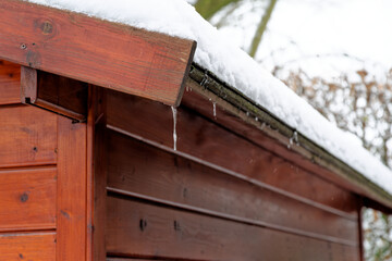 Roof of garden shed covered by snow - 691973725