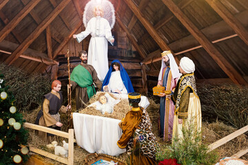 Nativity scene with Holy Family: baby Jesus, Blessed Virgin Mary, Saint Joseph, angel and three...