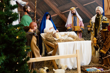 Nativity scene with Holy Family: baby Jesus, Blessed Virgin Mary, Saint Joseph, angel and three...