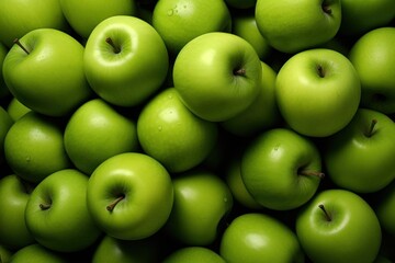  a pile of green apples with one green apple in the middle of the pile and one green apple in the middle of the pile. - obrazy, fototapety, plakaty