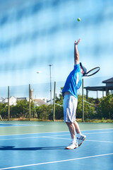 Tennis match, man and serve in outdoors, competition and playing on court at country club. Athlete,...