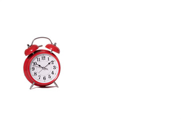 red retro alarm clock on a white background