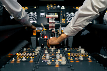 close-up of the cockpit of a passenger plane with many buttons on the control panel of an airplane flight simulator - obrazy, fototapety, plakaty