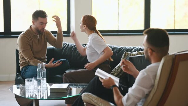 Screaming at each other. Couple at a psychologist's appointment.