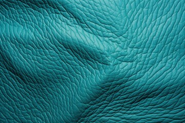  a close - up of a blue leather textured material that looks like a piece of cloth or something else.