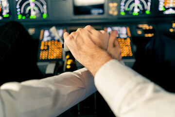 Airplane pilot controls throttle during flight or takeoff Cockpit view close-up of air traffic...