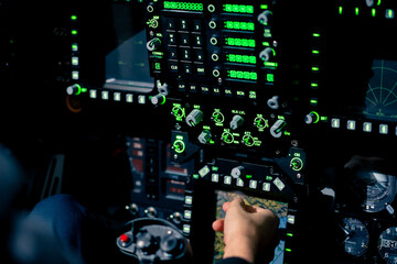 close-up hand of the pilot captain presses the buttons on the control panel to start the engine of the plane Flight simulator close-up