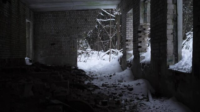 Interior of an abandoned brick building in winter 4k slow motion